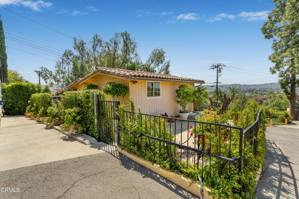 65 Wicks Road Moorpark, CA 93021 - Photo 13 of 21 a view of a house with wooden fence
