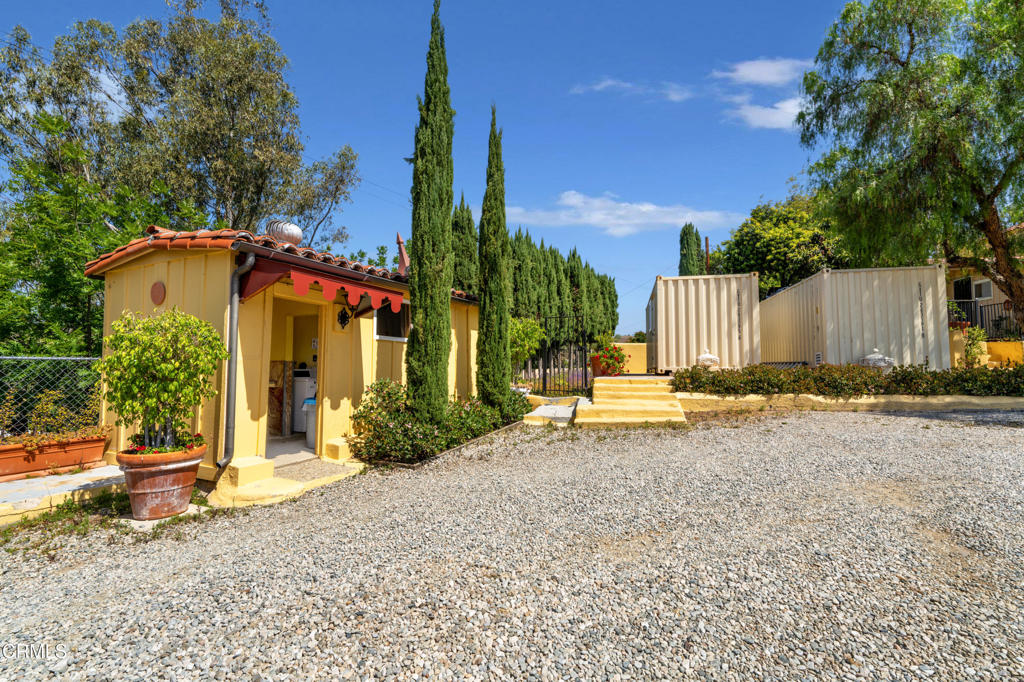 65 Wicks Road Moorpark, CA 93021 - Photo 10 of 21 a view of a house with backyard and a tree