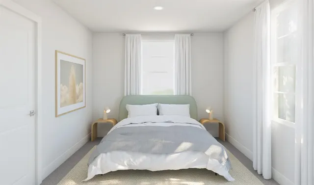 a bedroom with a bed and a dresser