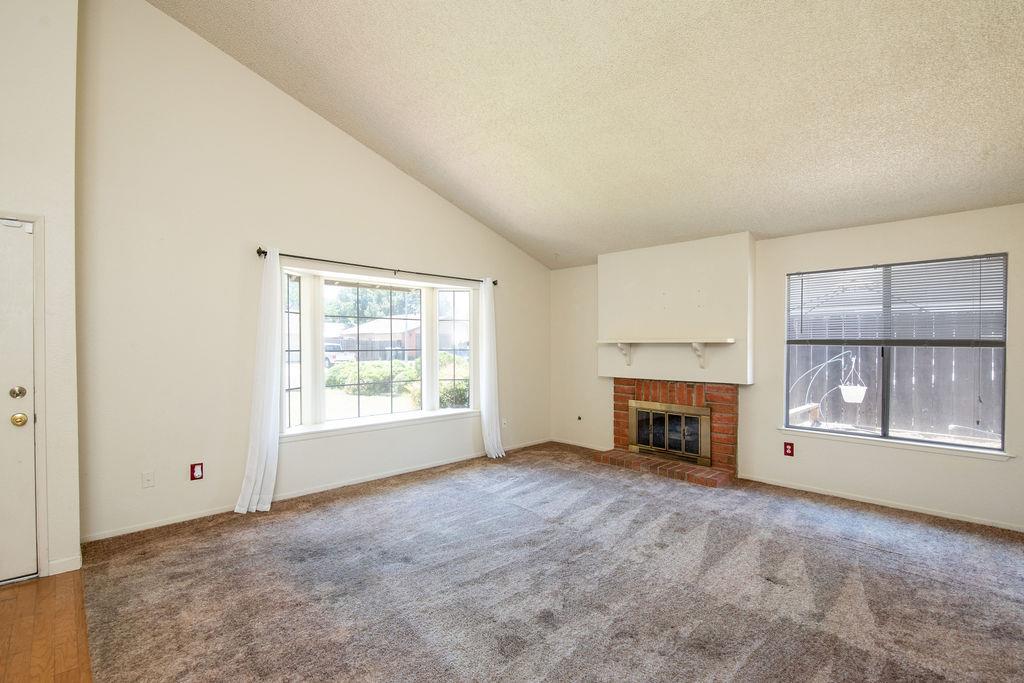 3333 Mesquite Way Modesto, CA 95355 - Photo 16 of 44 FRONT LIVING ROOM WITH CATHEDRAL CEILINGS