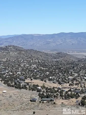 an aerial view of residential house and green space