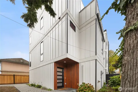 a building with a palm tree in front of it