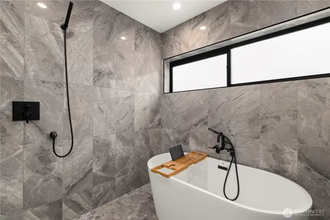 a view of a patio with couches and city view