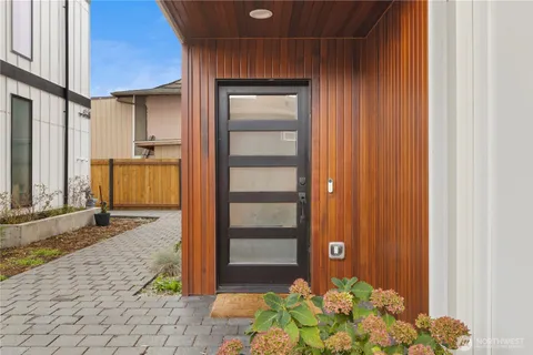 a view of a room with wooden floor and staircase