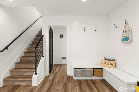a view of a workspace with furniture and a book shelf