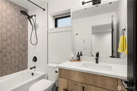 a view of room with furniture and wooden floor