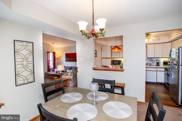 a dining room with furniture and window
