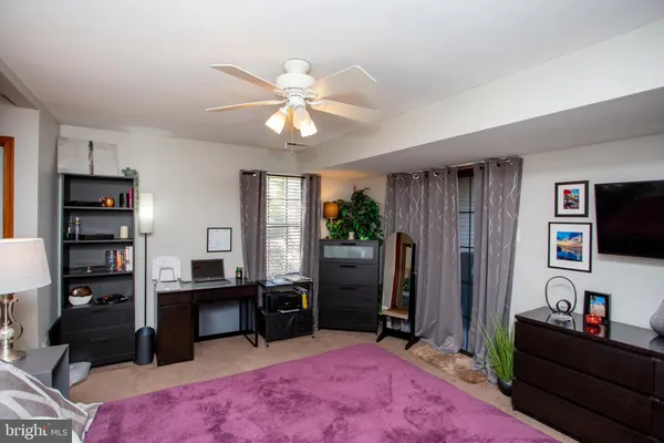 a view of a livingroom with furniture and a flat screen tv
