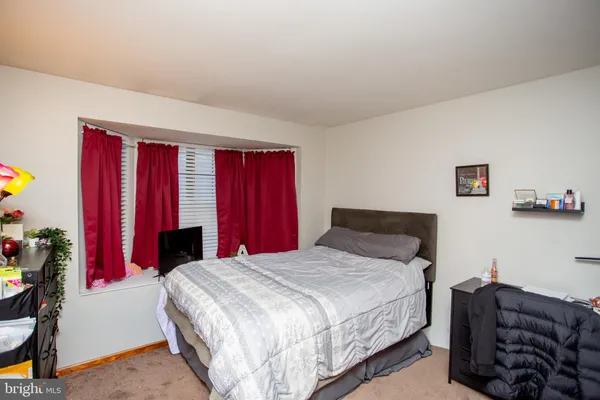 a bedroom with a bed and a closet