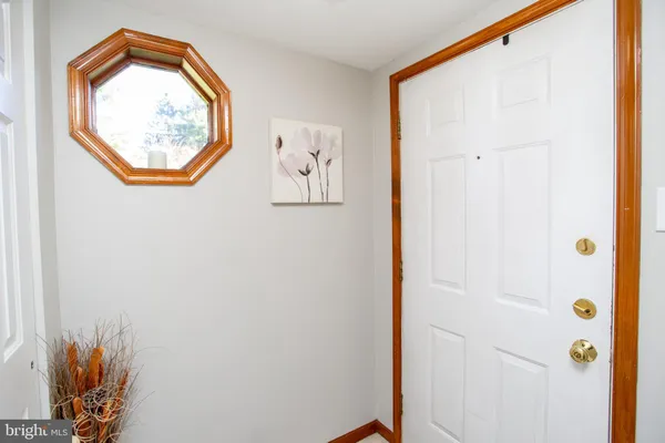 a view of a hallway with paintings on the wall