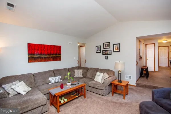 a living room with furniture and a couch