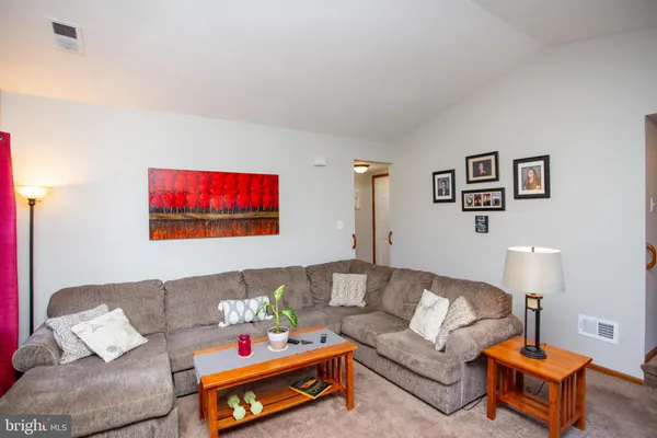 a living room with furniture and a couch