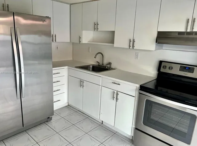 a kitchen with a stove and a microwave