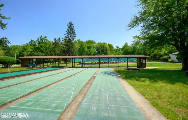 a view of swimming pool with a yard