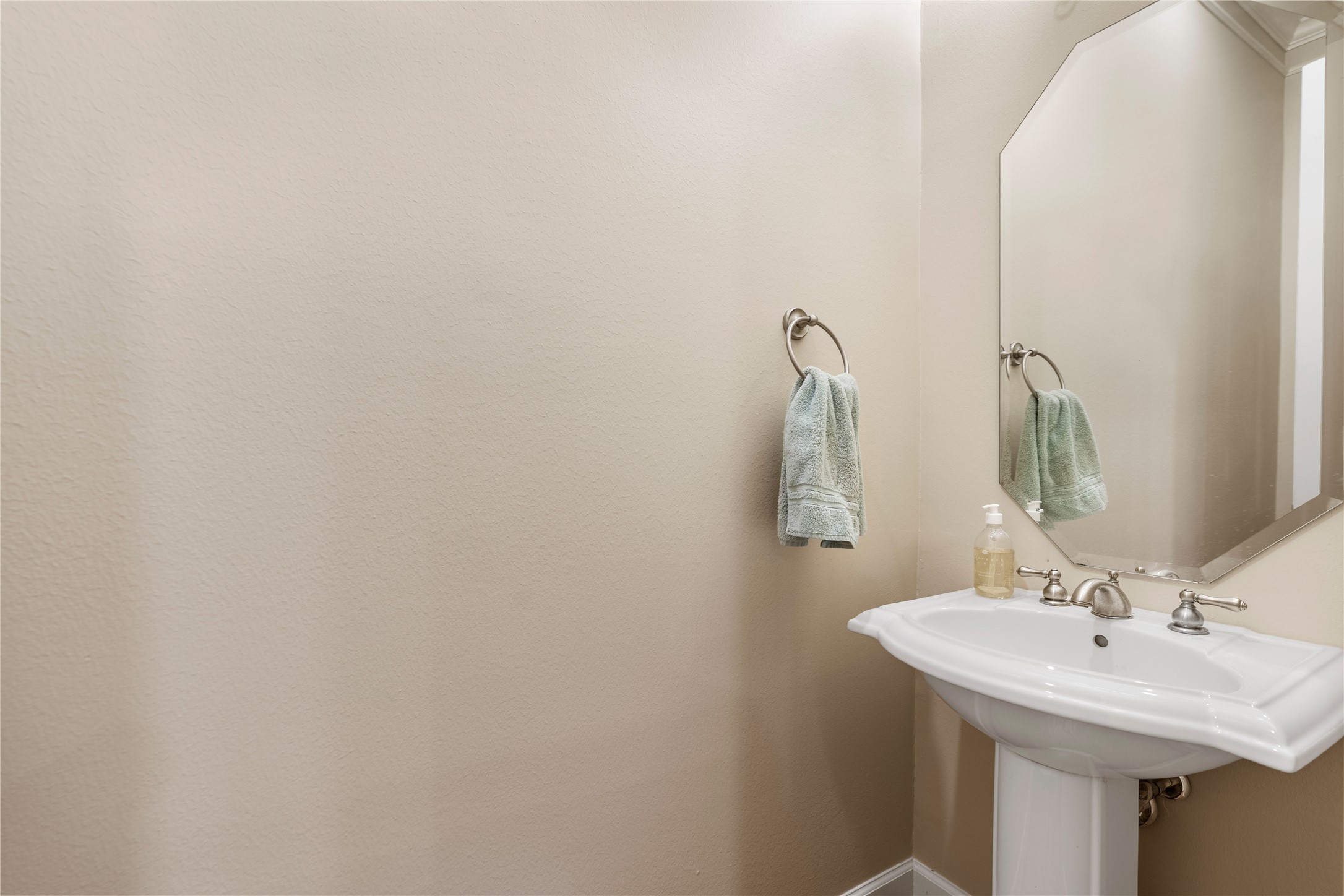 408 Fowler Street Houston, TX 77007 - Photo 14 of 24 Second-floor powder bath with pedestal sink—perfect for guests and easily accessible from main living areas.