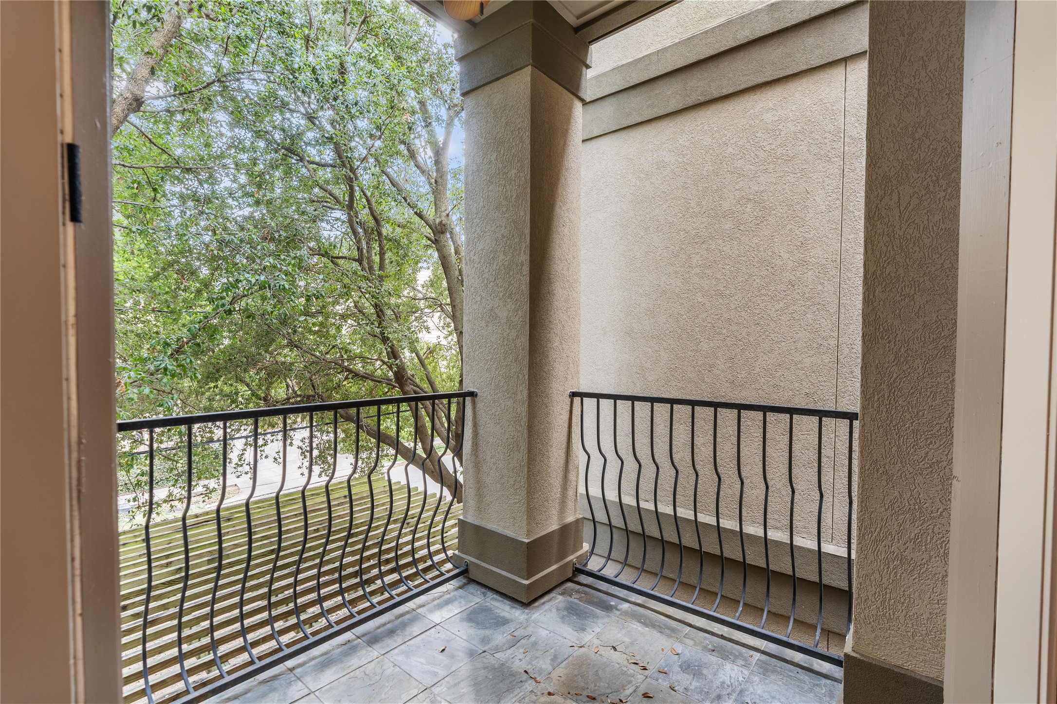 408 Fowler Street Houston, TX 77007 - Photo 15 of 24 Enjoy morning coffee or evening breezes from the second-floor balcony, nestled among mature trees.