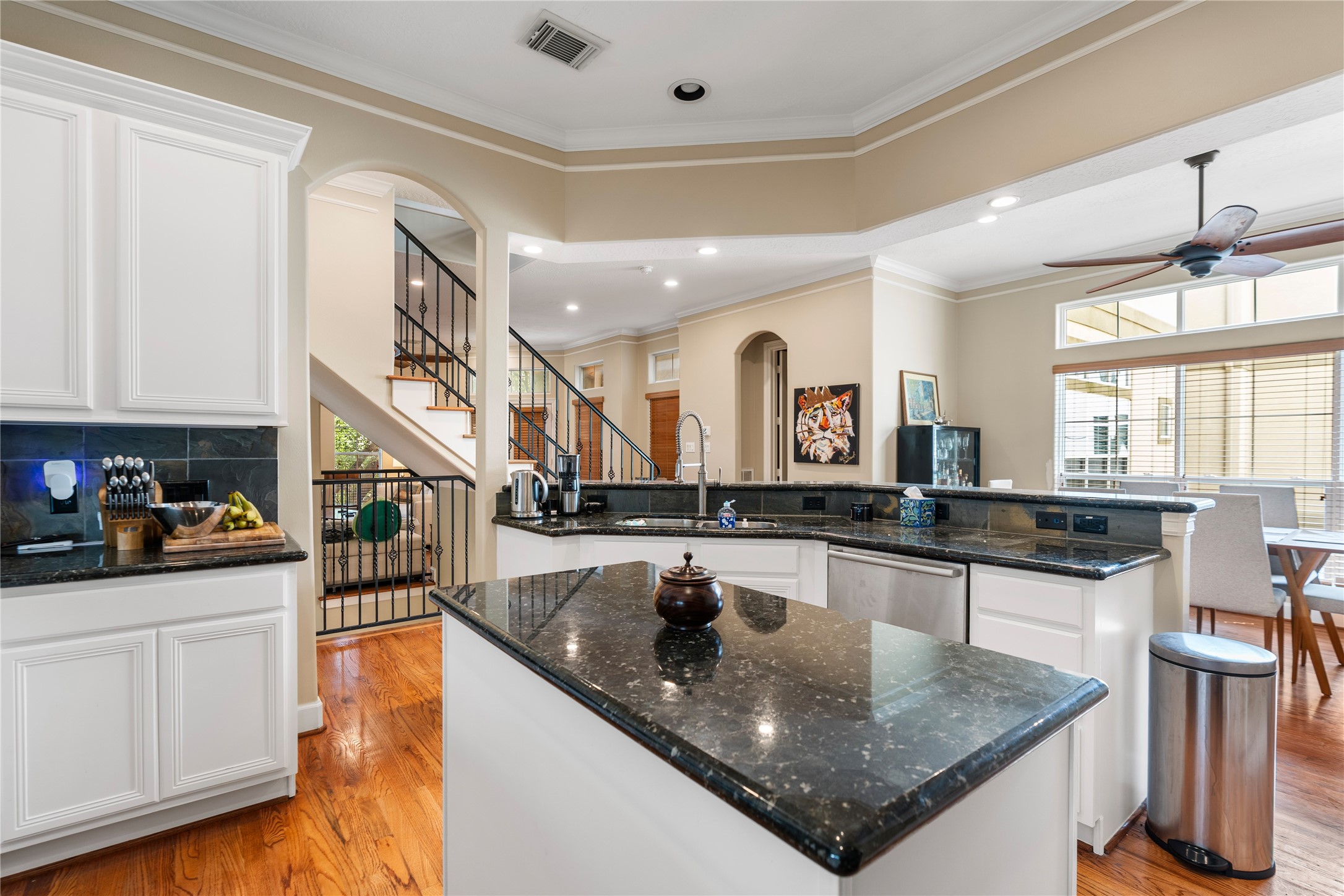 408 Fowler Street Houston, TX 77007 - Photo 9 of 24 The second floor offers seamless flow from the kitchen to living and dining, with hardwood floors and crown molding throughout.