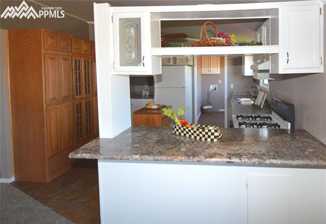 27055 Handle Road Calhan, CO 80808 - Photo 8 of 25 Looking into the kitchen from the dining room.