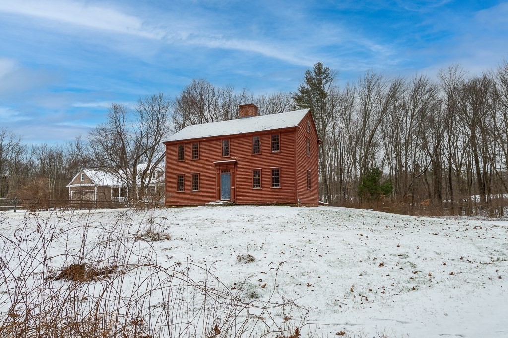 8 Old Common Road Sutton, MA 01590 - Photo 1 of 35 a view of a house with a snow in the yard