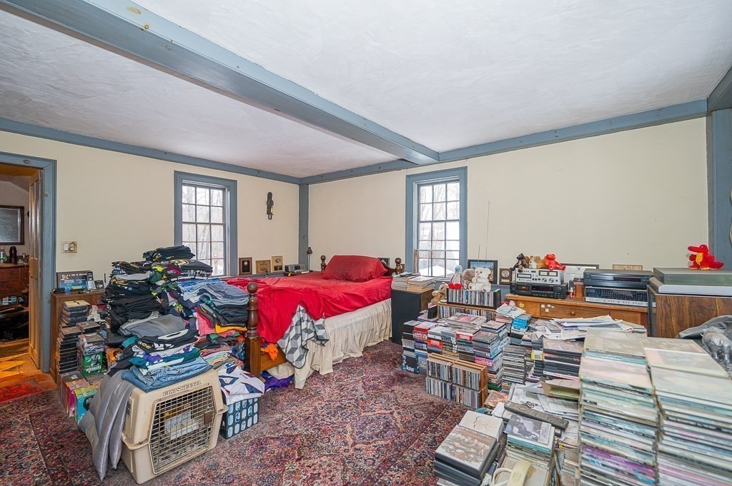 8 Old Common Road Sutton, MA 01590 - Photo 12 of 35 a living room with lots of furniture and a wooden floor