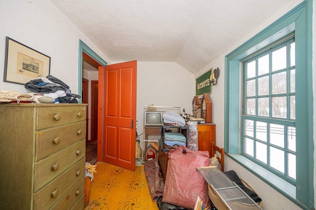 8 Old Common Road Sutton, MA 01590 - Photo 24 of 35 a bedroom with a bed and wooden floor