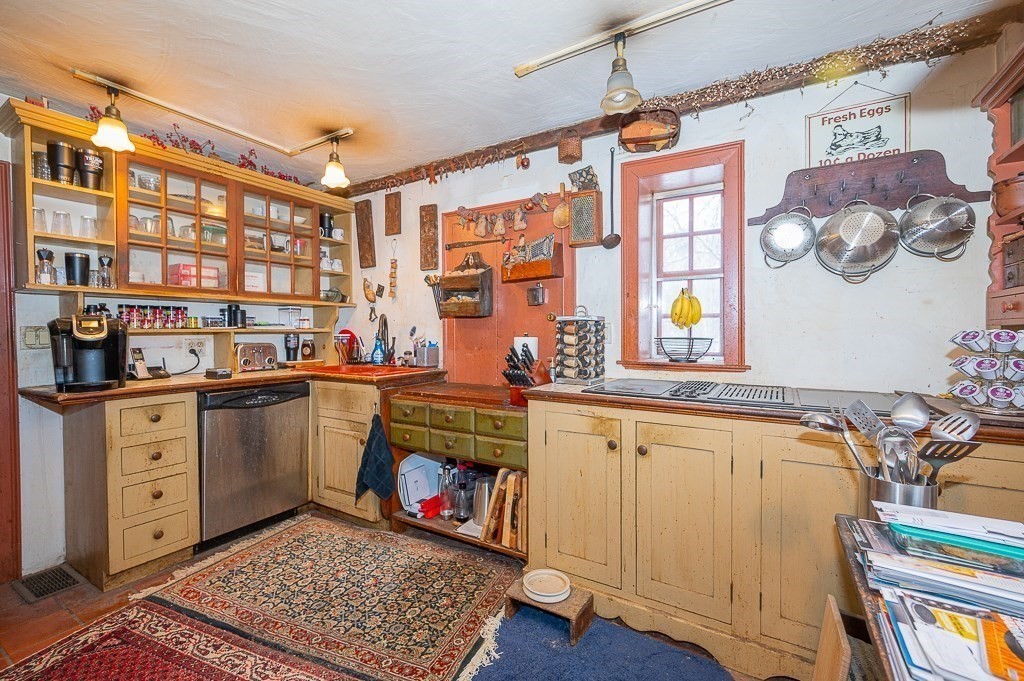 8 Old Common Road Sutton, MA 01590 - Photo 3 of 35 a view of a kitchen with a sink and cabinets