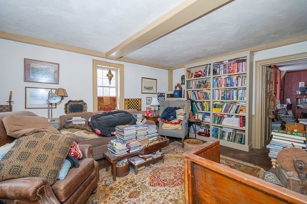 8 Old Common Road Sutton, MA 01590 - Photo 7 of 35 a living room with furniture fireplace and a window