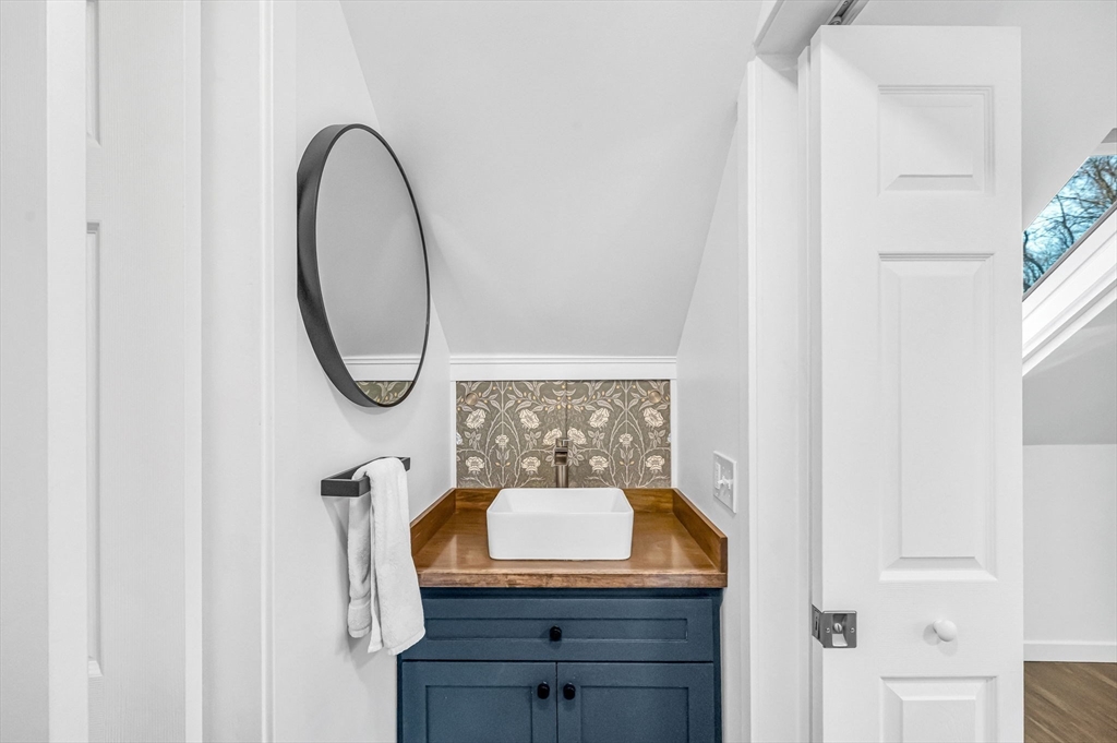 10 Kelsey Street East Longmeadow, MA 01028 - Photo 19 of 28 a bathroom with a granite countertop sink and a mirror