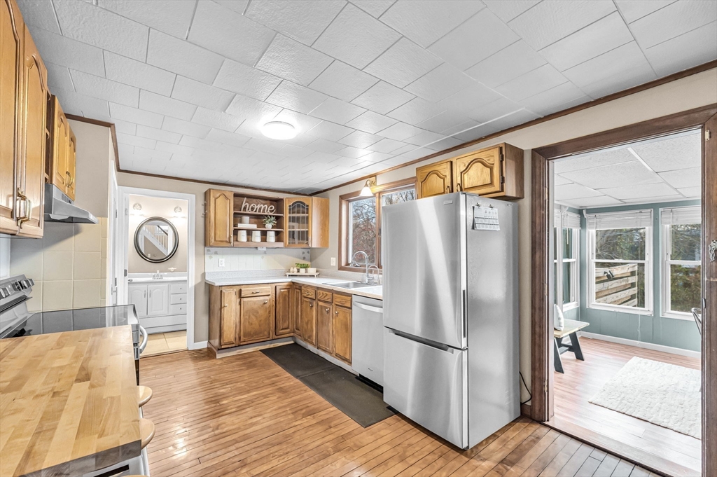 10 Kelsey Street East Longmeadow, MA 01028 - Photo 9 of 28 a kitchen with a refrigerator a stove top oven and a large window