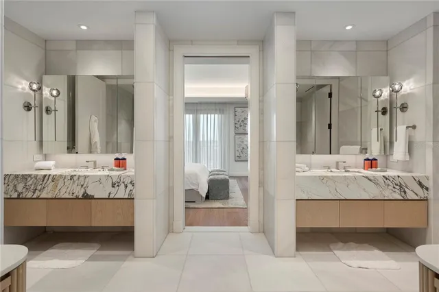 a en suite bathroom with a tub sink and mirror