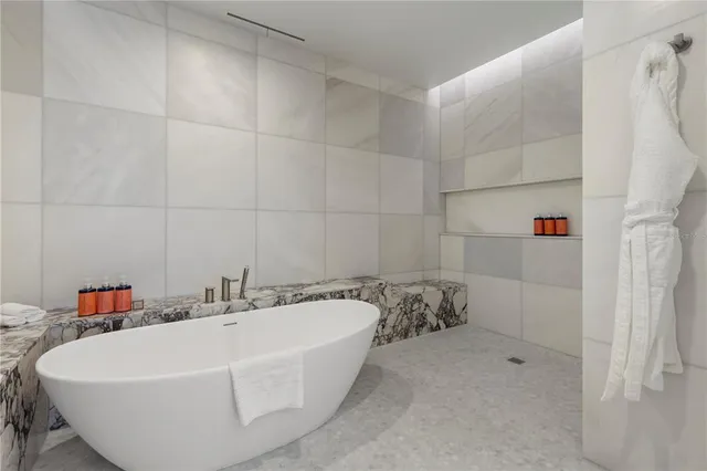 a white bath tub sitting in a bathroom