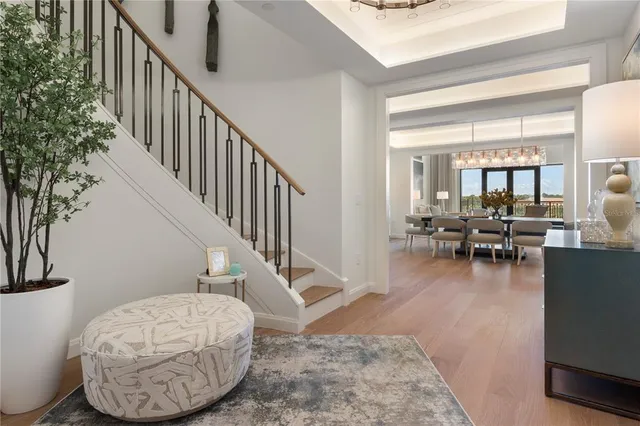 a view of a livingroom with furniture and staircase