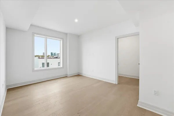 an empty room with windows and pillars in it
