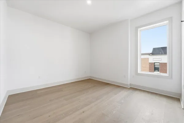 a view of a hall with dining area and glass door