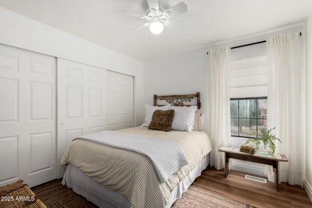 a bedroom with a bed and a window