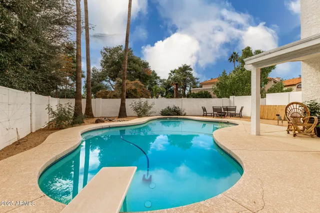 a view of a swimming pool with a patio
