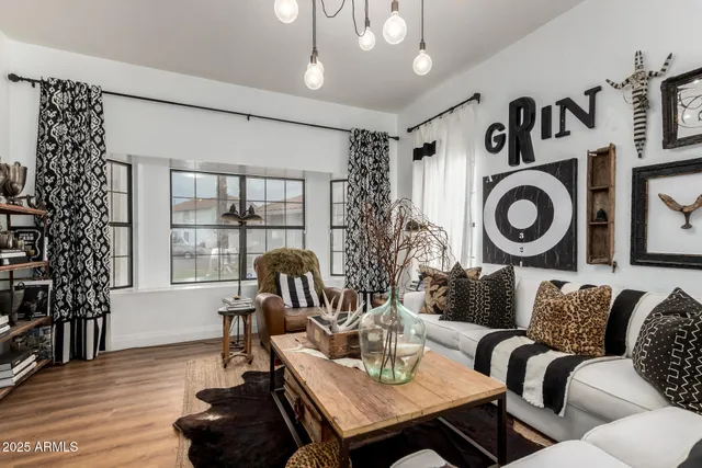 a living room with furniture and a table