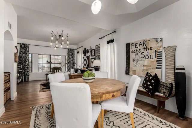 a bed room with furniture and a chandelier