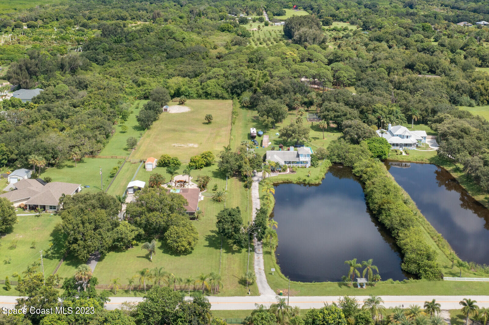 0 West Crisafulli Road Merritt Island, FL 32953 - Photo 2 of 11 an aerial view of residential houses with outdoor space