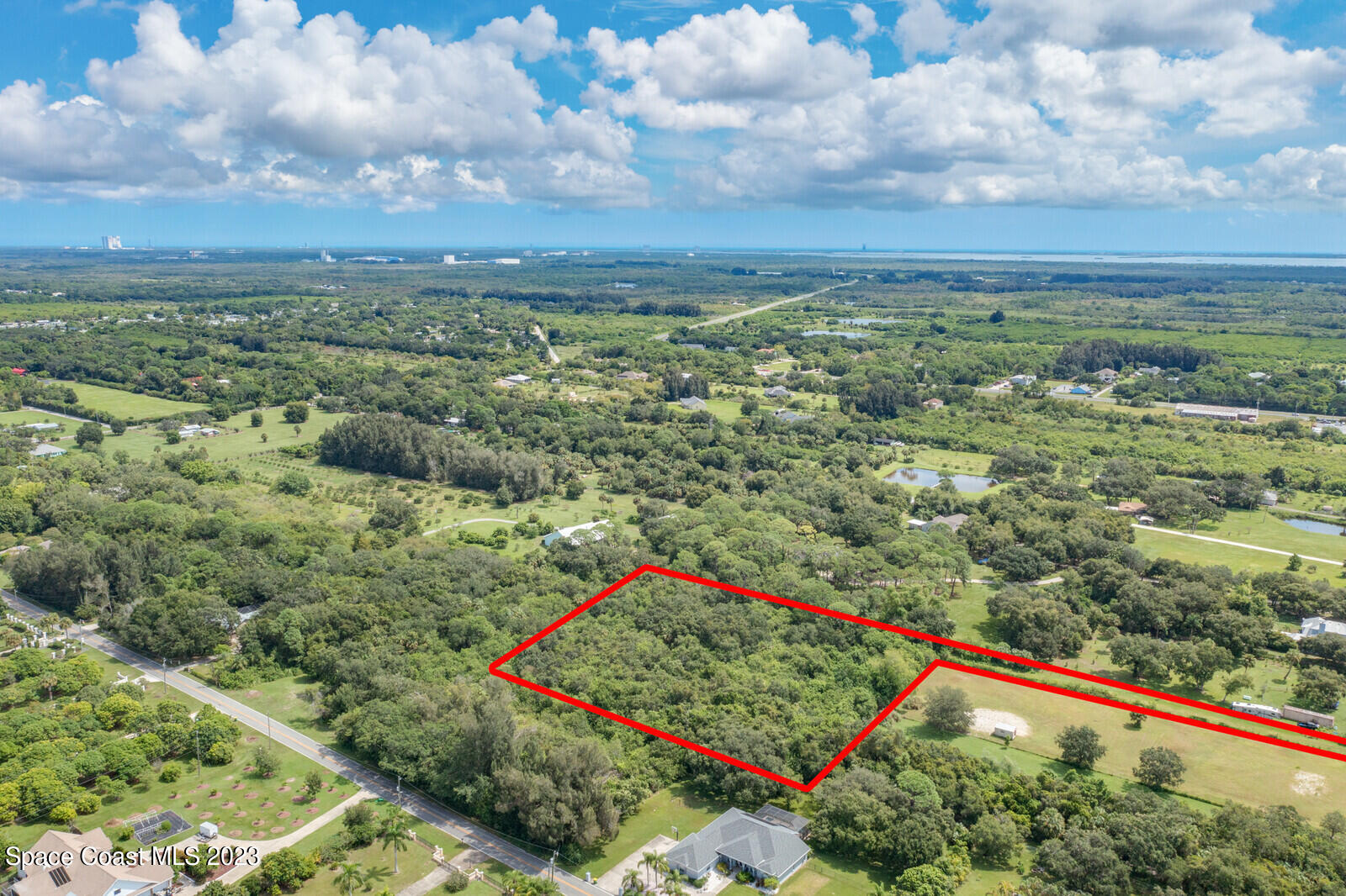 0 West Crisafulli Road Merritt Island, FL 32953 - Photo 3 of 11 a view of a yard with an ocean and trees
