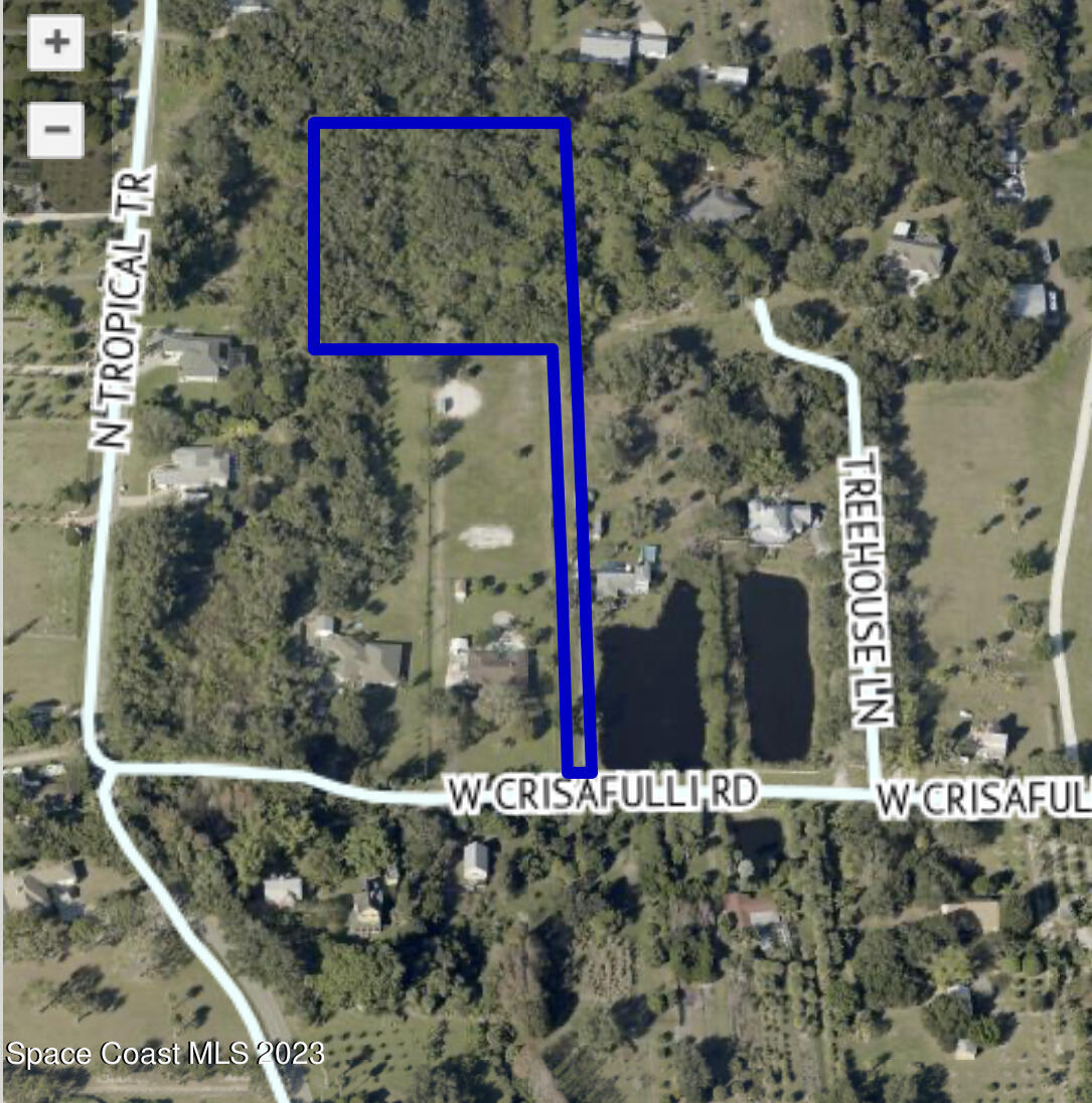 0 West Crisafulli Road Merritt Island, FL 32953 - Photo 9 of 11 a street sign that is on the side of the road