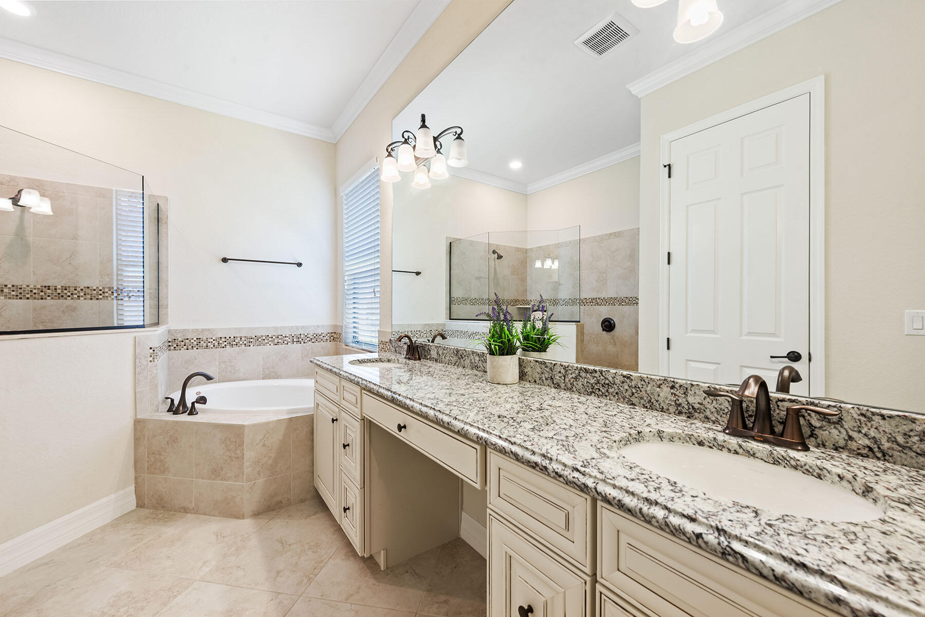 3009 Aviamar Circle Naples, FL 34114 - Photo 11 of 50 a bathroom with a granite countertop double vanity sink and bathtub