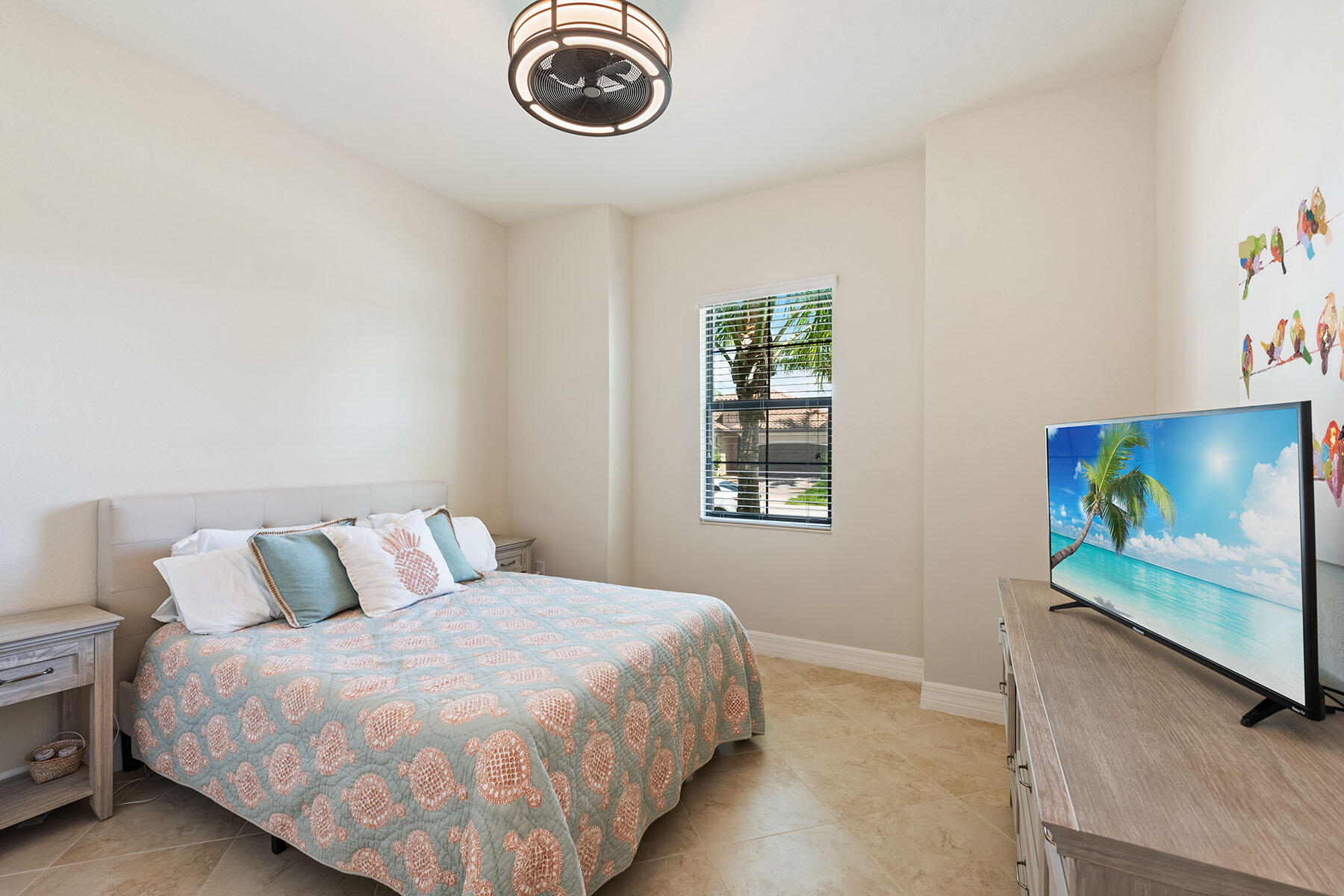 3009 Aviamar Circle Naples, FL 34114 - Photo 12 of 50 a bedroom with a bed and a flat screen tv