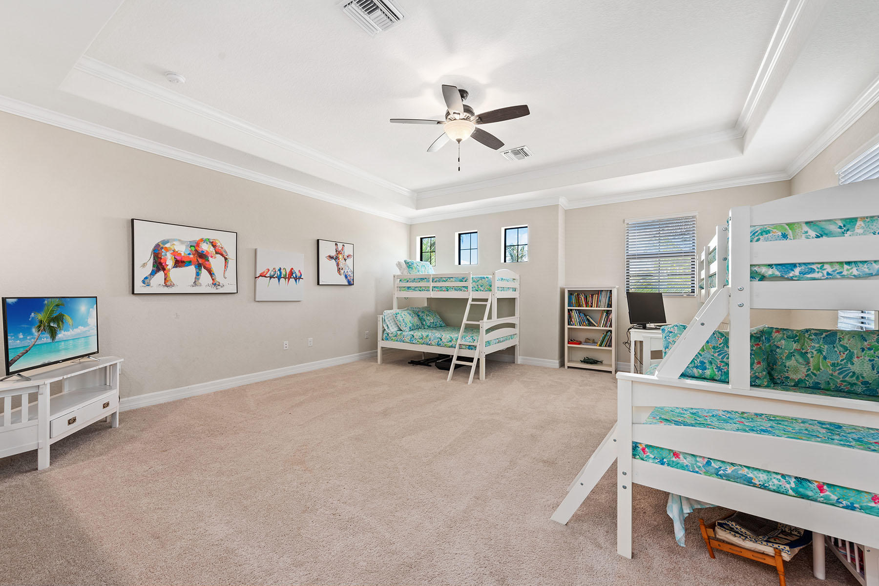 3009 Aviamar Circle Naples, FL 34114 - Photo 17 of 50 a living room with furniture a flat screen tv and a table