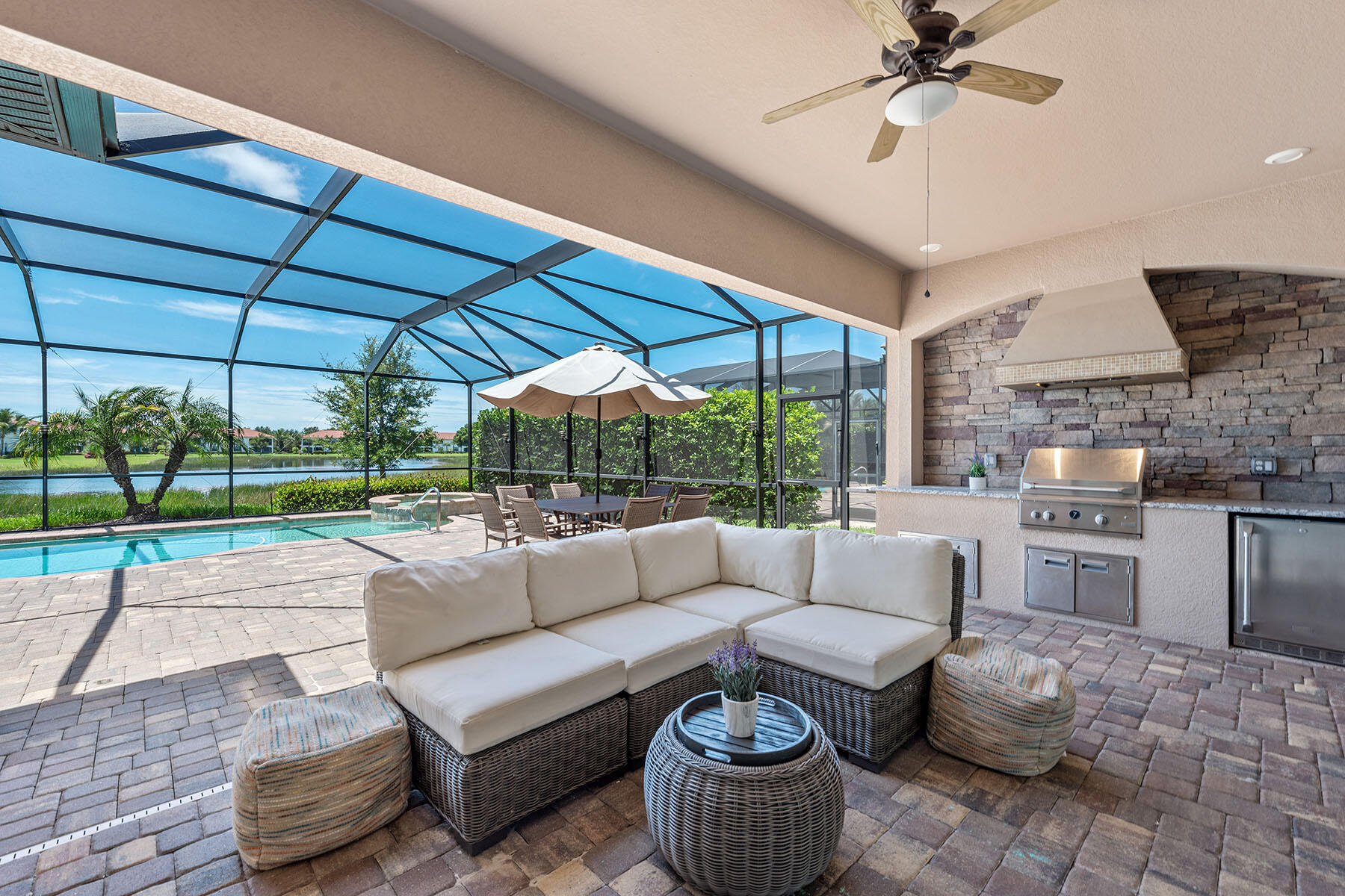 3009 Aviamar Circle Naples, FL 34114 - Photo 21 of 50 a living room with furniture and a floor to ceiling window