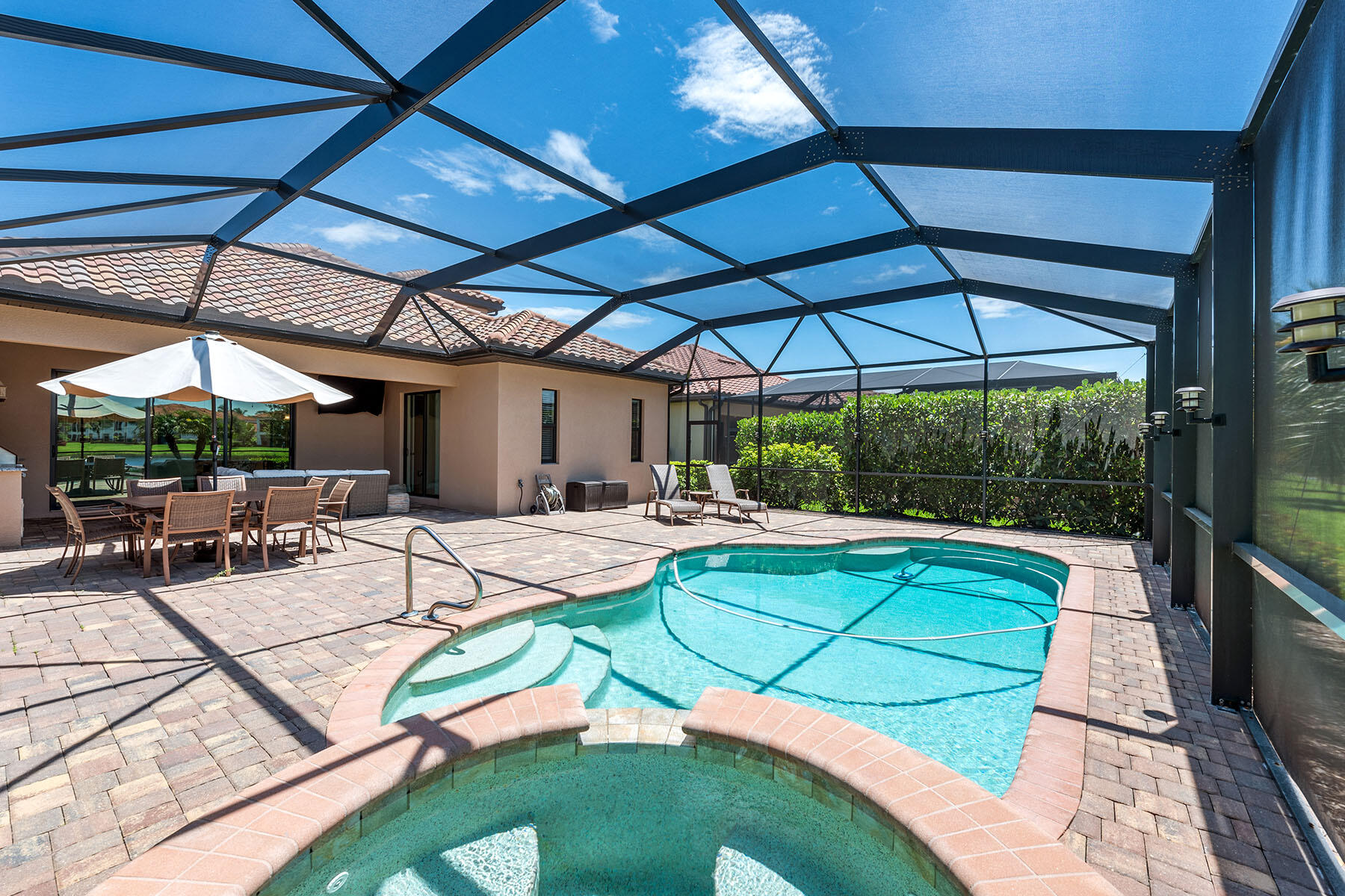 3009 Aviamar Circle Naples, FL 34114 - Photo 26 of 50 a view of a swimming pool with a patio
