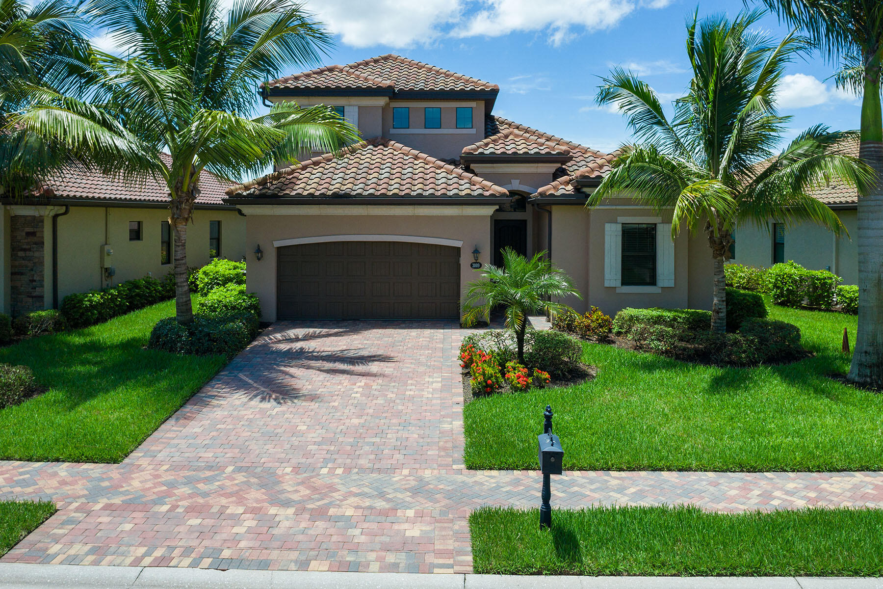3009 Aviamar Circle Naples, FL 34114 - Photo 29 of 50 a front view of a house with a garden