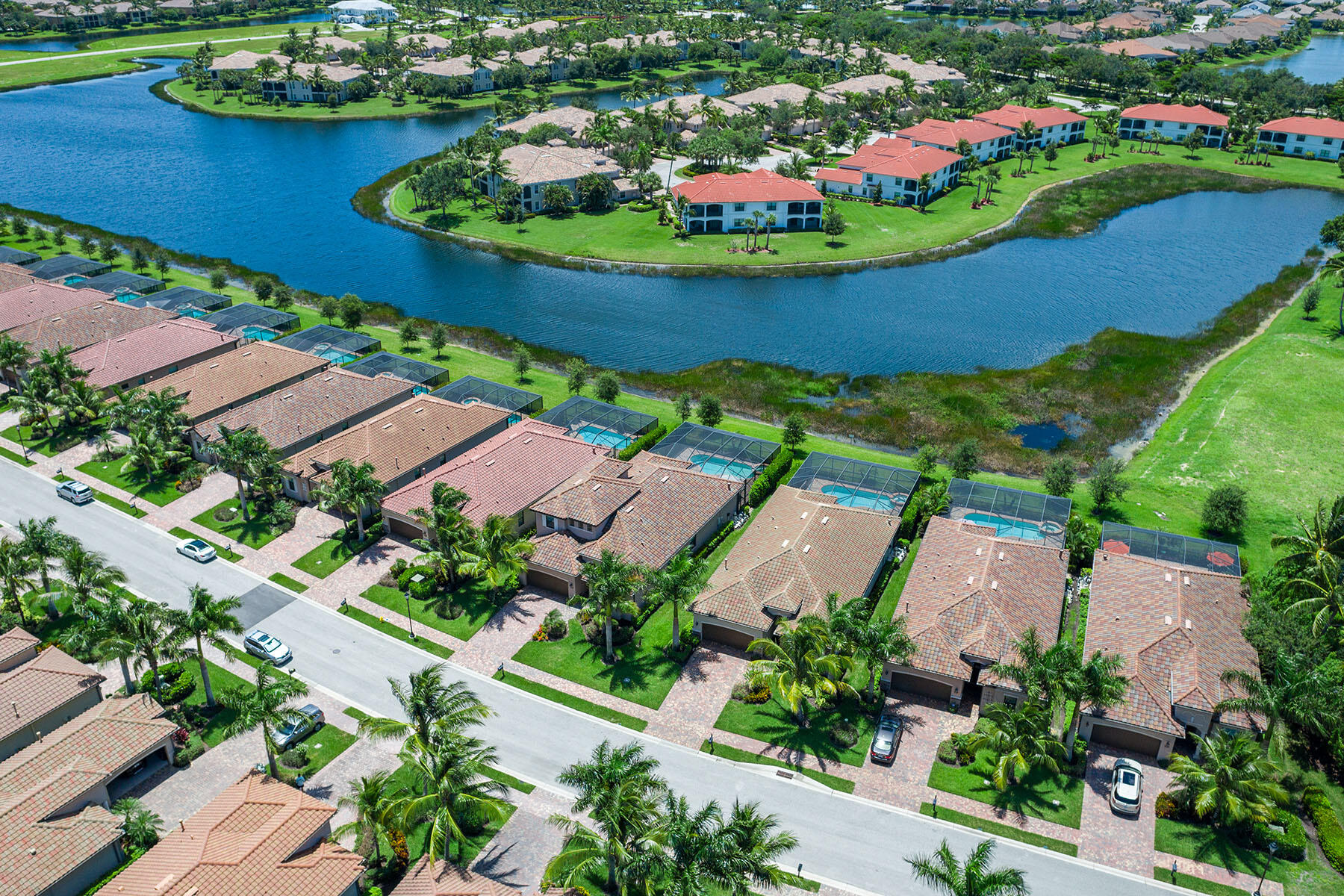 3009 Aviamar Circle Naples, FL 34114 - Photo 31 of 50 an aerial view of a house with a garden and lake view
