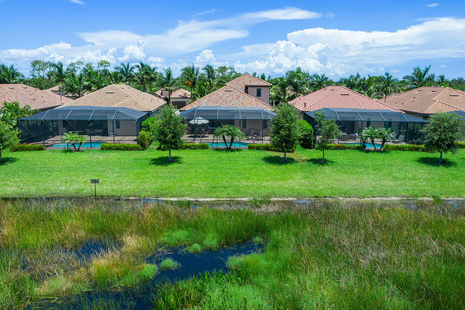 3009 Aviamar Circle Naples, FL 34114 - Photo 32 of 50 a view of a garden with a house