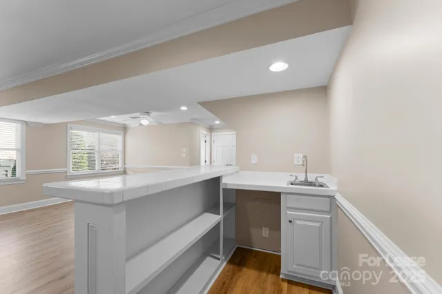 a kitchen with a sink and window